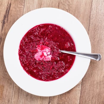 Vegetarian vegetable soup on a wooden table