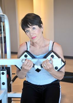 Female beauty working out inside a health club.