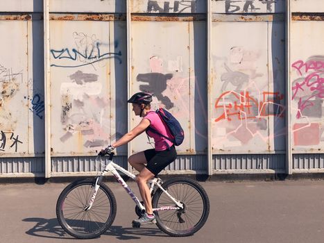 Kiev, Ukraine - April 04, 2017: Pedestrian goes Graffiti wall background. Urban street