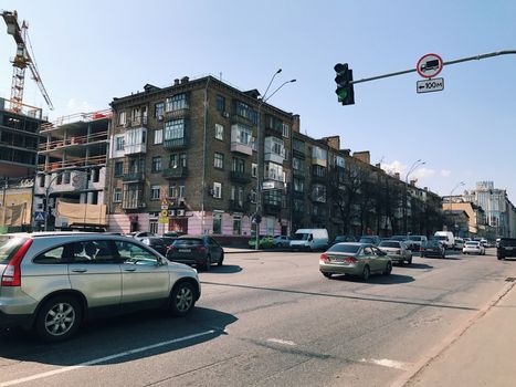 Kiev, Ukraine - April 04, 2017: Traffic in a big city on a bridge cityscape