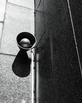 Old metal loudspeakers on marmoreal wall of subway in black and white