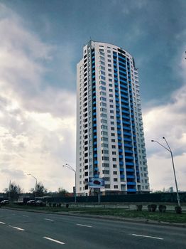 Top part of high-rise business building on blue sky 