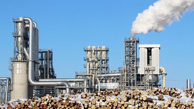 White smoke from the chimney on blue sky background. Ecology environment industry factory pollution