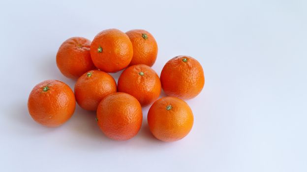 Pile of mandarin on white background. Food fruit