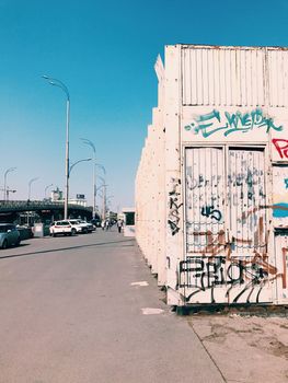 Street art wall, graffiti in a big city on bridge cityscape