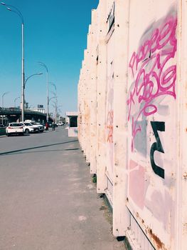 Street art wall, graffiti in a big city on bridge cityscape