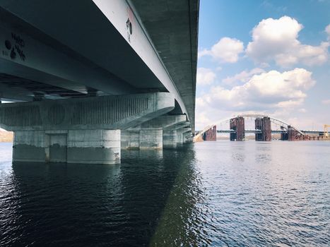 Abandoned old bridge, big engineering construction with metal concrete