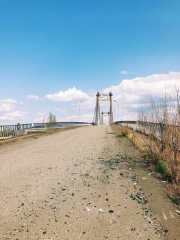 Abandoned old bridge, big engineering construction with metal concrete