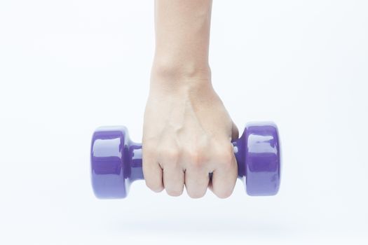 Woman hand holding dumbbell weight isolated on white background, stock photo