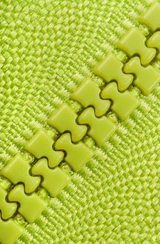 Abstract background green closed zipper diagonally located