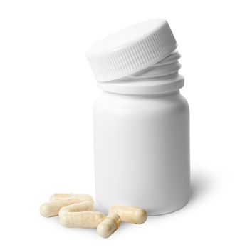 Beige capsule near the plastic bottle isolated on white background