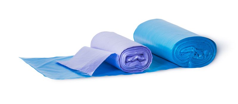 Blue and violet rolls of plastic garbage bags isolated on white background