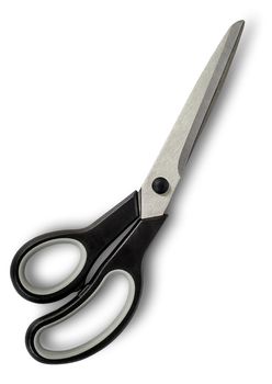 Closed big scissors with black handles isolated on white background