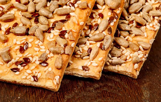 Closeup cereal cookies with seeds on a wooden table