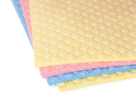 Closeup multicolored sponges for dishwashing isolated on white background
