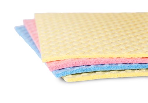 Closeup multicolored sponges for dishwashing rotated isolated on white background