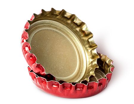 Closeup of two red caps from beer bottles isolated on white background