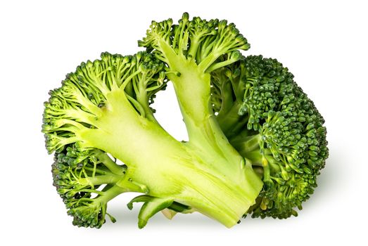 Closeup of whole and half broccoli isolated on white background