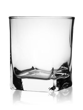 Empty glass for whiskey rotated isolated on white background