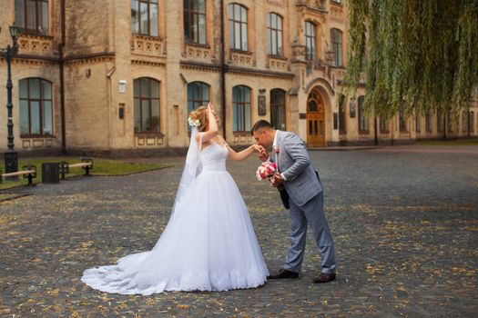 Newlyweds on a walk in the summer day wedding