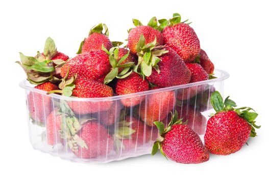 Freshly strawberries in a plastic tray and two near rotated isolated on white background