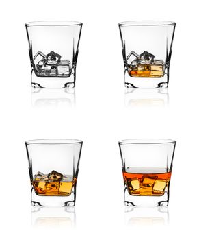 Glass of scotch whiskey and ice isolated on white background