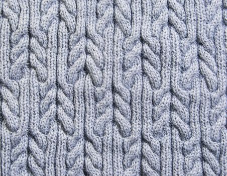 Gray background knitted fabric of wool yarn homework