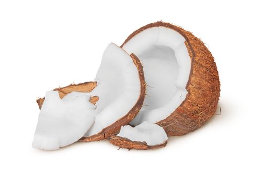 Half coconut with a few pieces of pulp isolated on white background