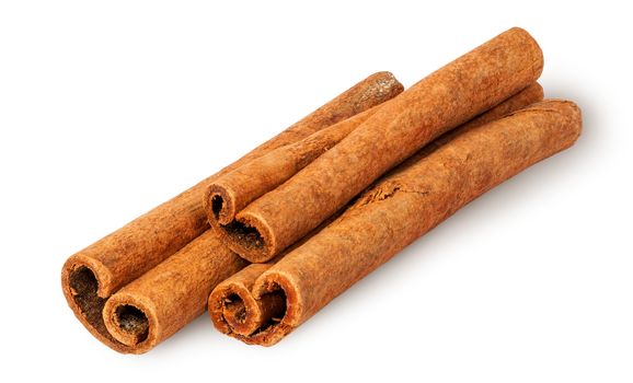 Heap of cinnamon sticks isolated on white background