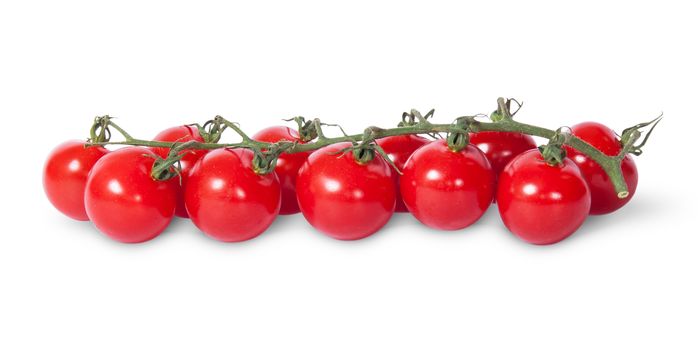In front cherry tomatoes on the stem isolated on white background