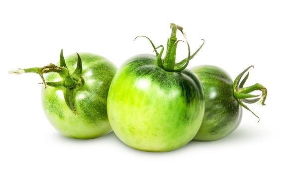 In front three green tomatoes near isolated on white background