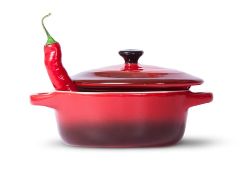 In front red chili pepper in saucepan with lid isolated on white background