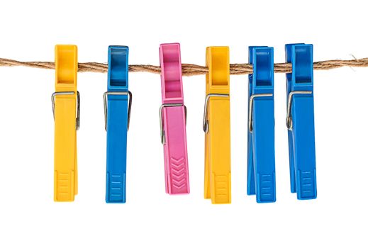 Multicolored plastic clothespins on a rope isolated on white background