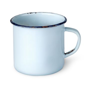 Old worn enameled mug rotated isolated on white background
