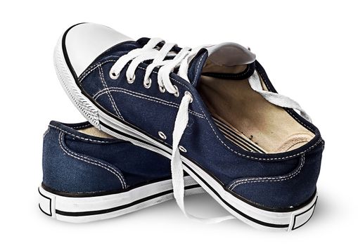 One pair of dark blue sports shoes on one another isolated on white background