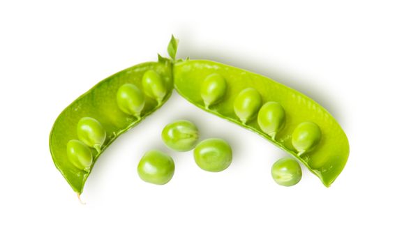 Opened green pea pod and several peas isolated on white background