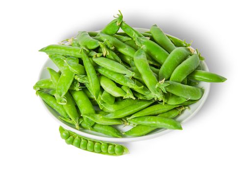 Opening and closing pea pods on white plate top view isolated on white background