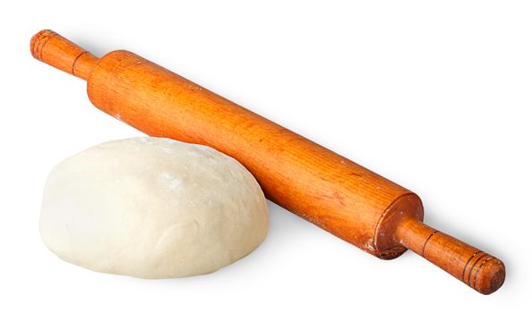 Piece of dough beside rolling pin isolated on white background
