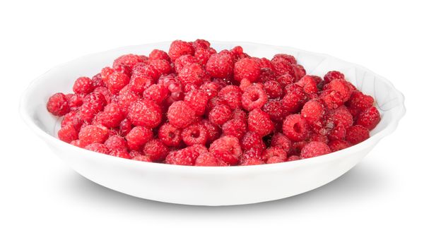 Pile Of Fresh Raspberries On A White Plate Isolated On White Background
