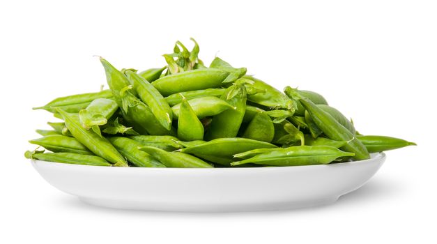 Pile of green peas in pods on white plate isolated on white background