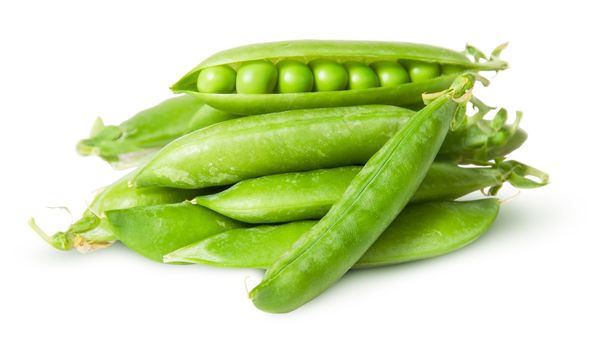 Pile of fresh green peas in the pods isolated on white background