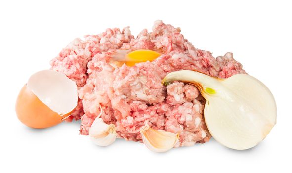 Raw Ground Beef With Egg, Garlic And Onions Isolated On White Background