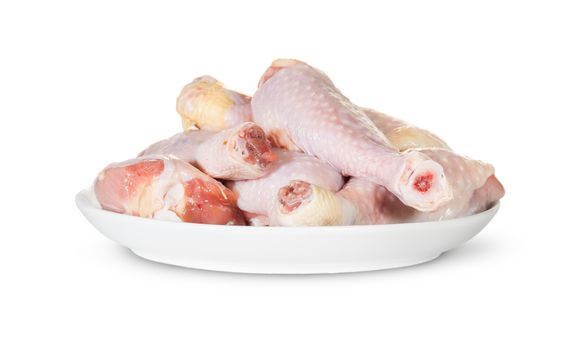 Raw Chicken Legs On White Plate Isolated On White Background