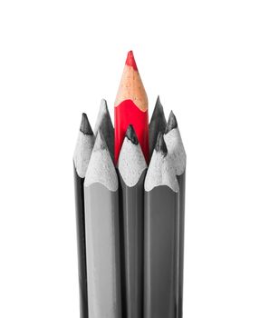 Red pencil surrounded by black and white pencils isolated on white background
