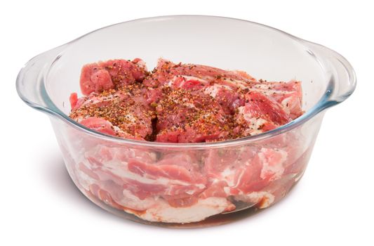 Raw Pork With Spices In A Glass Bowl Isolated On White Background