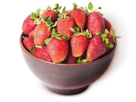 Ripe juicy strawberries in a ceramic bowl top view isolated on white background