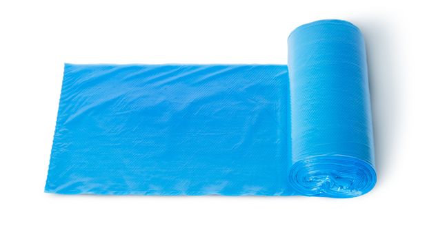 Roll of blue plastic garbage bags top view isolated on white background