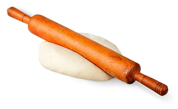 Rolling pin on a piece of dough isolated on white background