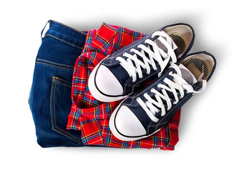 Shirt jeans and sports shoes isolated on white background