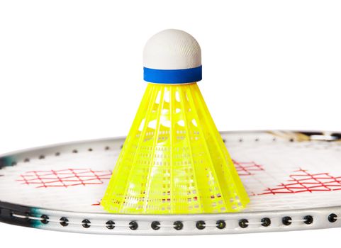 Shuttlecock stand on the badminton racket isolated on white background